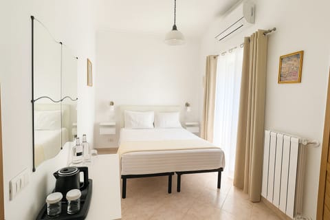 Economy Room, Balcony | Minibar, in-room safe, desk, blackout drapes