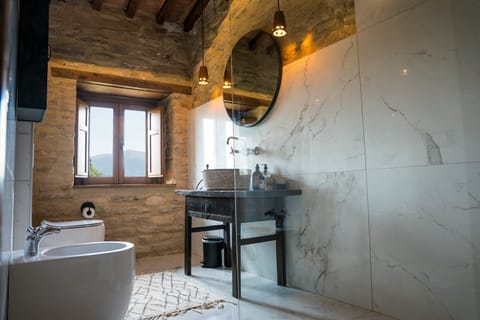 Deluxe Suite, Hill View | Bathroom | Hair dryer, slippers, towels, soap