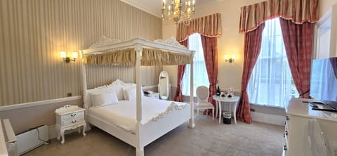 Manor House Four Poster Room | Desk, iron/ironing board, cribs/infant beds, rollaway beds