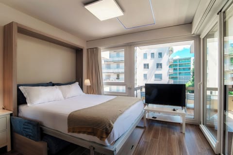 Deluxe Studio, City View | Living area | Flat-screen TV