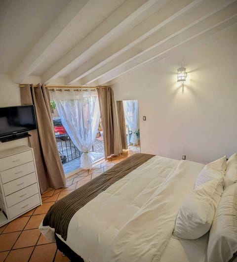 Down comforters, Select Comfort beds, laptop workspace, blackout drapes