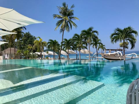 2 outdoor pools, open 6:00 AM to 7:00 PM, free cabanas, pool umbrellas