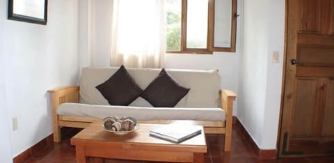 Quadruple Room | Living area | Flat-screen TV, fireplace