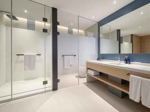 1 Bedroom Suite Stocked Minibar Included | Bathroom | Shower, hydromassage showerhead, free toiletries, hair dryer