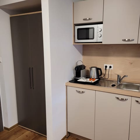 Family Quadruple Room, Balcony | In-room safe, individually decorated, individually furnished