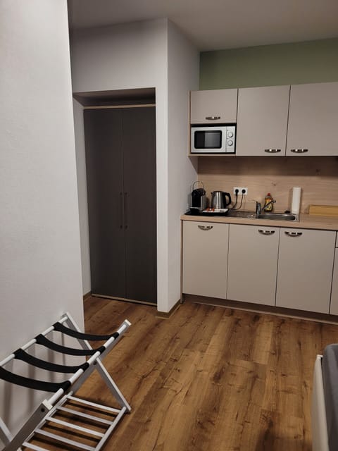 Family Quadruple Room, Balcony | In-room safe, individually decorated, individually furnished