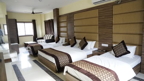 Deluxe Quadruple Room, Multiple Beds, Air conditioning | Premium bedding, desk, laptop workspace