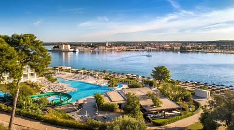 Indoor pool, outdoor pool, pool umbrellas, sun loungers