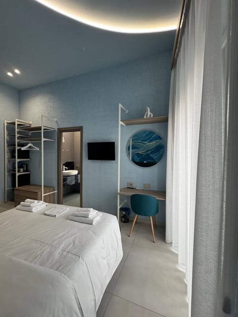 Deluxe Room, Balcony, City View | In-room safe, desk, soundproofing, iron/ironing board
