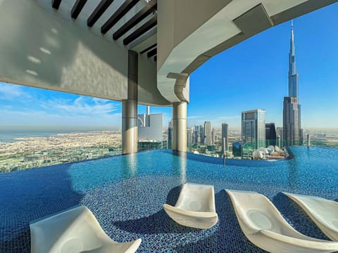 Outdoor pool, open 7:00 AM to 7:00 PM, pool umbrellas, sun loungers