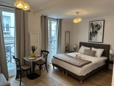 Apartment | Laptop workspace, iron/ironing board, bed sheets