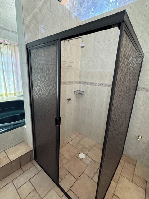 Senior Studio Suite | Bathroom | Shower, towels, soap, shampoo