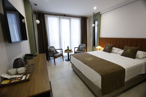 Deluxe Double Room, City View | In-room safe, desk, laptop workspace, blackout drapes