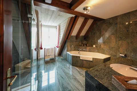 Luxury Duplex, Kitchen, Courtyard View | Bathroom | Hair dryer, slippers, towels, soap