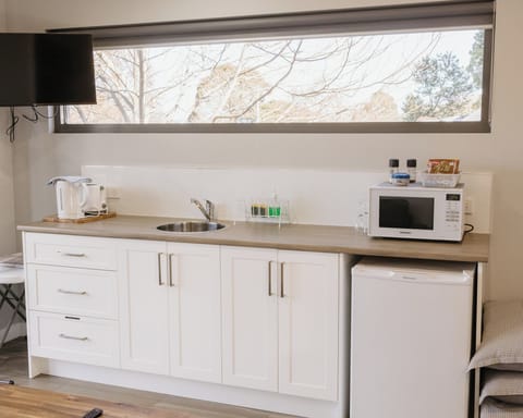 Family Quadruple Room, River View | Private kitchen | Mini-fridge, microwave, stovetop, electric kettle