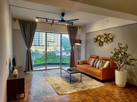 Family Apartment, 4 Bedrooms | Living area | 22-inch flat-screen TV with digital channels