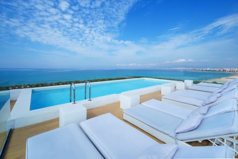 Outdoor pool, pool umbrellas, sun loungers