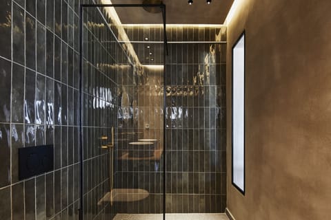 Deluxe Suite, Hot Tub, Partial Sea View | Bathroom | Shower, hair dryer, slippers, towels