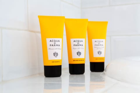 Designer toiletries, hair dryer, bathrobes, slippers