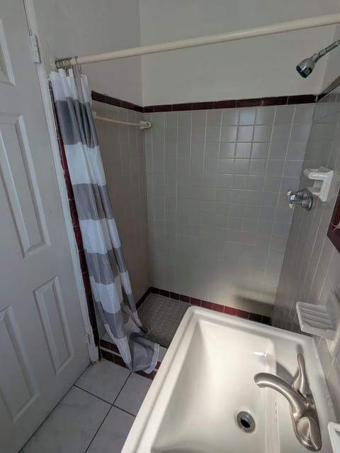 Economy Room, Beach View | Bathroom | Shower, free toiletries, toilet paper