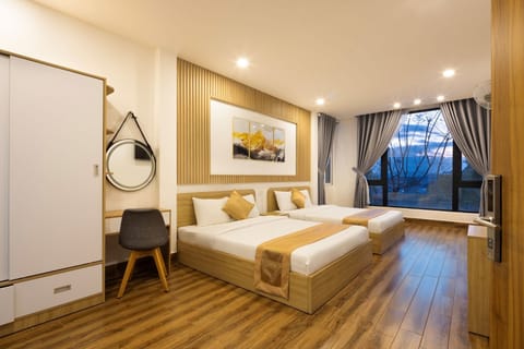 Luxury Quadruple Room | Desk, laptop workspace, blackout drapes, free WiFi