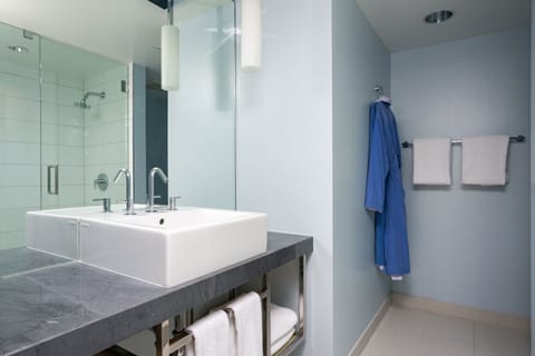 Designer toiletries, hair dryer, bathrobes, towels