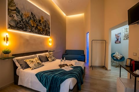 Triple Room, Private Bathroom | Minibar (free items), in-room safe, blackout drapes, soundproofing