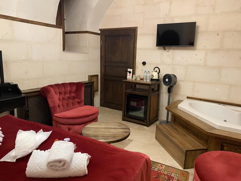 Luxury Studio Suite, Courtyard View | In-room safe, desk, soundproofing, iron/ironing board