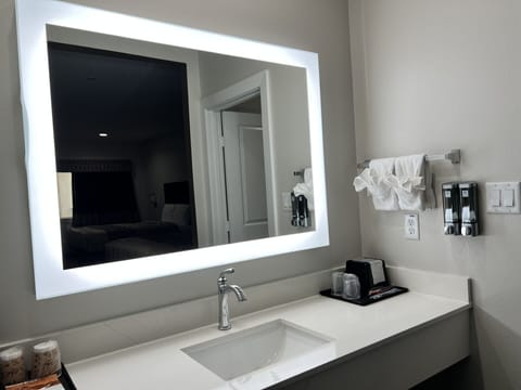 Bathtub, towels, soap, shampoo