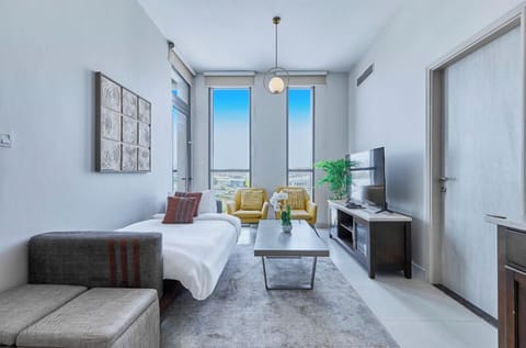 Premium Apartment, 1 Bedroom, City View | Living room | 55-inch Smart TV with cable channels