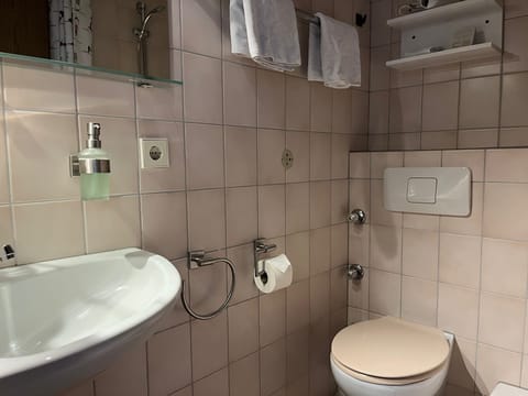 Basic Single Room, Balcony | Bathroom | Shower, hair dryer, towels, soap