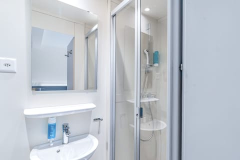 Family Triple Room, City View | Bathroom | Shower, free toiletries, hair dryer, towels