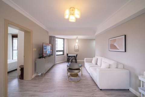 Superior Apartment, 1 Bedroom, Kitchen, City View | Living room | 55-inch Smart TV with cable channels