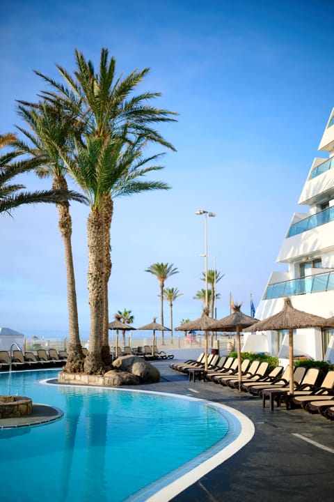 2 outdoor pools, pool umbrellas, sun loungers
