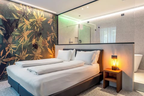 Deluxe Suite, Balcony | Minibar, in-room safe, soundproofing, iron/ironing board