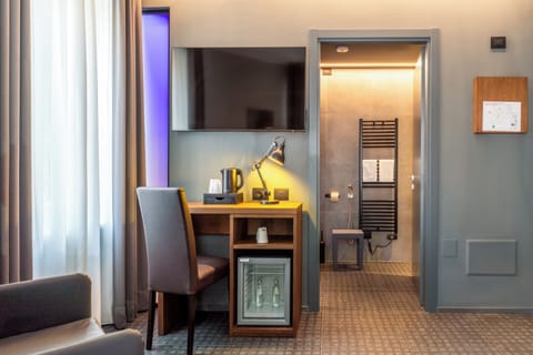 Junior Suite, Balcony | Minibar, in-room safe, soundproofing, iron/ironing board