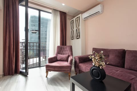 Standard Apartment, Balcony | Living area | 50-inch flat-screen TV with cable channels