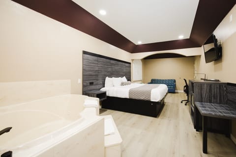 King Room with Jacuzzi Smoking  | In-room safe, desk, blackout drapes, iron/ironing board
