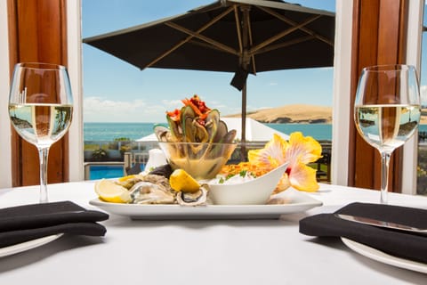 Breakfast, dinner served; local cuisine, beach views 