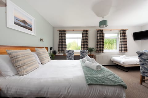 Family Quadruple Room, Private Bathroom, Ground Floor | Desk, laptop workspace, free WiFi