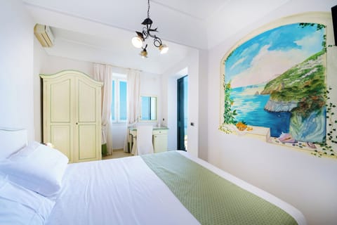 Standard Double or Twin Room, Patio, Sea View | Frette Italian sheets, premium bedding, down comforters