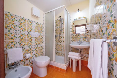 Standard Quadruple Room, Patio, Sea View | Bathroom | Shower, free toiletries, hair dryer, towels