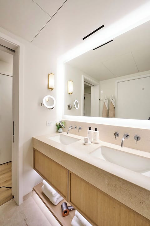 Shower, hair dryer, slippers, towels