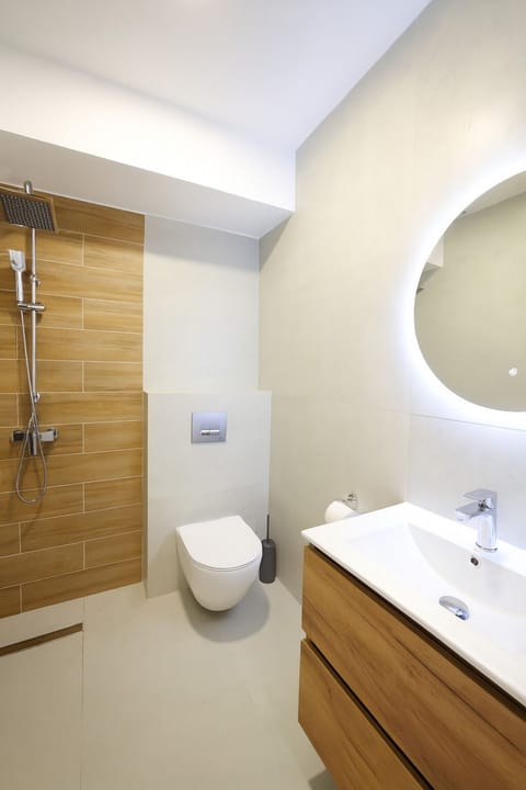 Shower, hair dryer, slippers, towels