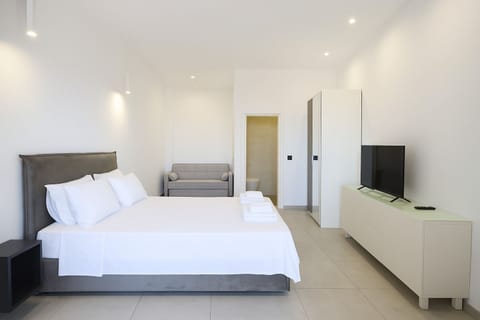 Standard Quadruple Room, Balcony, Sea View | Minibar, blackout drapes, soundproofing, iron/ironing board