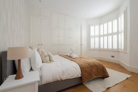 Luxury House | Desk, laptop workspace, blackout drapes, iron/ironing board