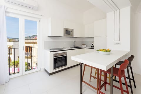 Exclusive Apartment, Partial Sea View | Private kitchen | Fridge, oven, stovetop, espresso maker