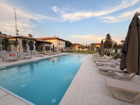 Seasonal outdoor pool, pool umbrellas, sun loungers
