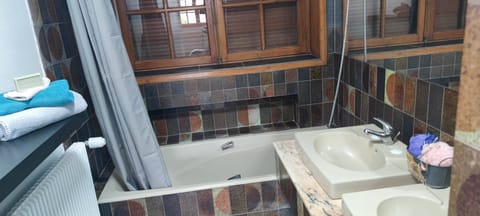 Combined shower/tub, hair dryer, towels, soap