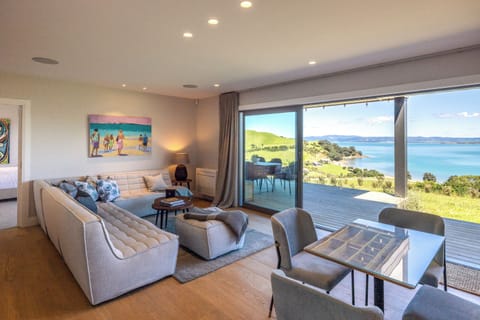 Deluxe Apartment, Ocean View | Living area | Flat-screen TV